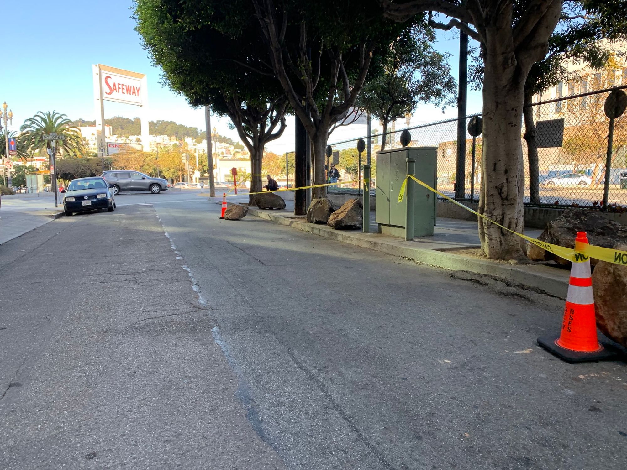 For The Third Time In Ten Days, Clinton Park Boulders Placed Back On Sidewalk After Being Shoved Off