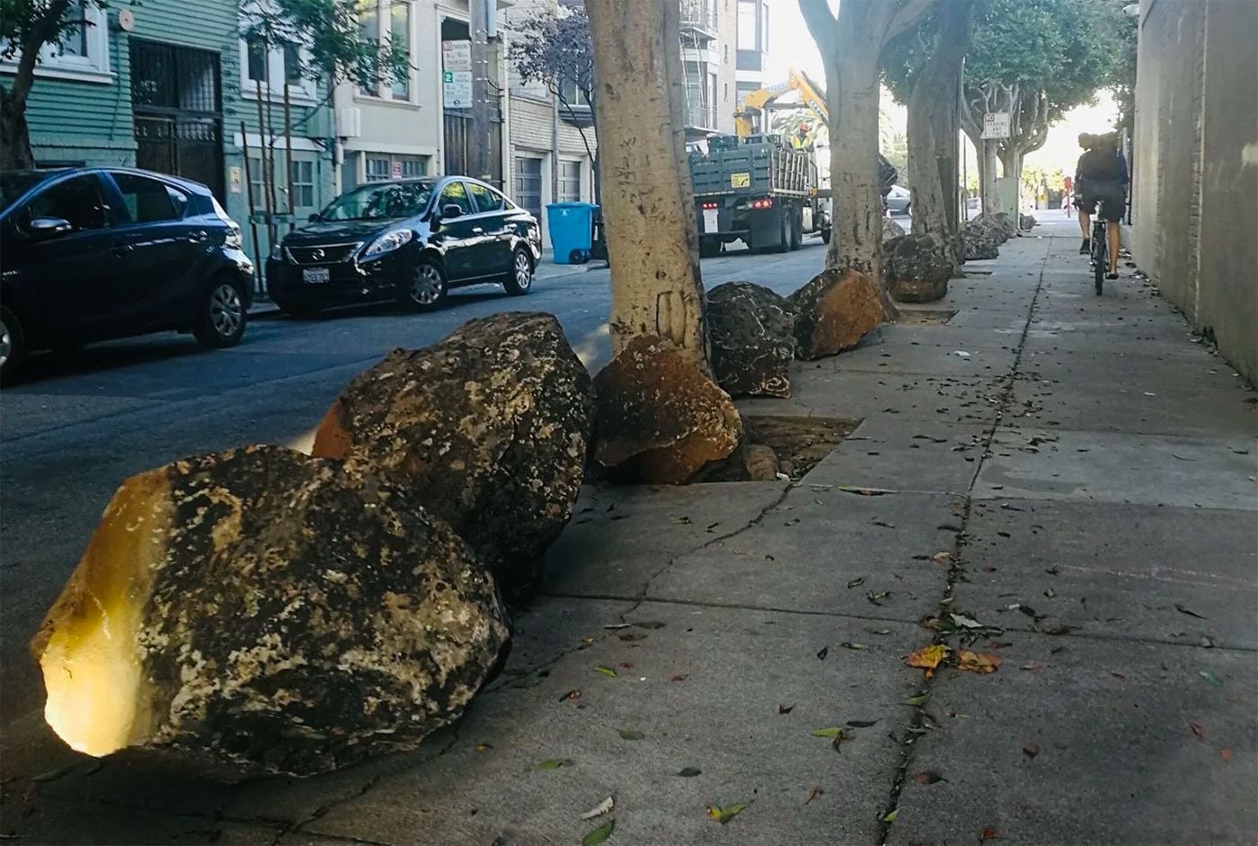 Controversial Boulders Get Rolled Off Clinton Park Sidewalk Onto Street