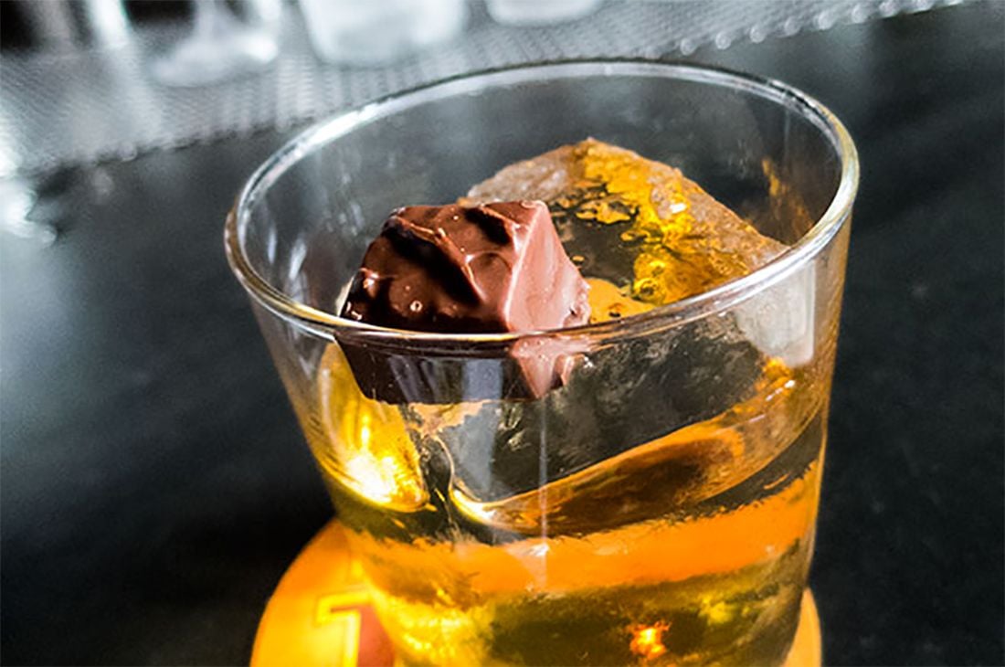 Trick Dog Is Garnishing a Cocktail With a 3 Musketeers Bar