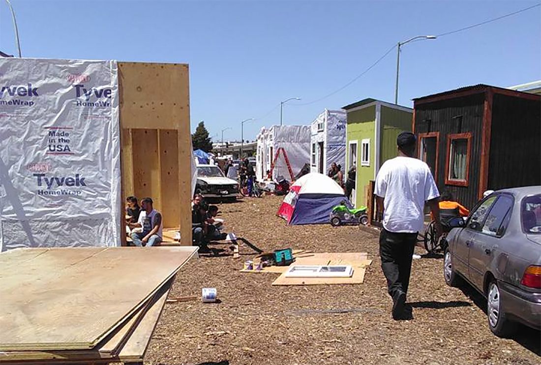 Oakland Homeless Group 'The Village' Constructs Tiny House Community On Median
