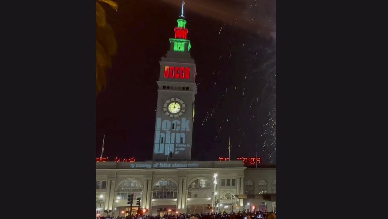 Projection Pranksters Hit Ferry Building During New Year’s Fireworks, Mock Mayor Breed, Elon Musk, Trump