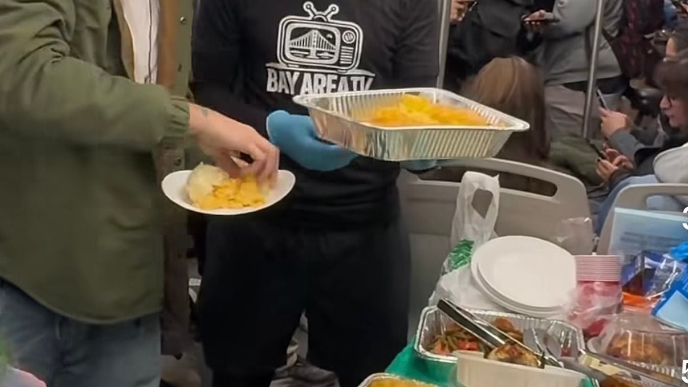 Watch: Local Content Creator Hosts Thanksgiving Feast Aboard BART Train