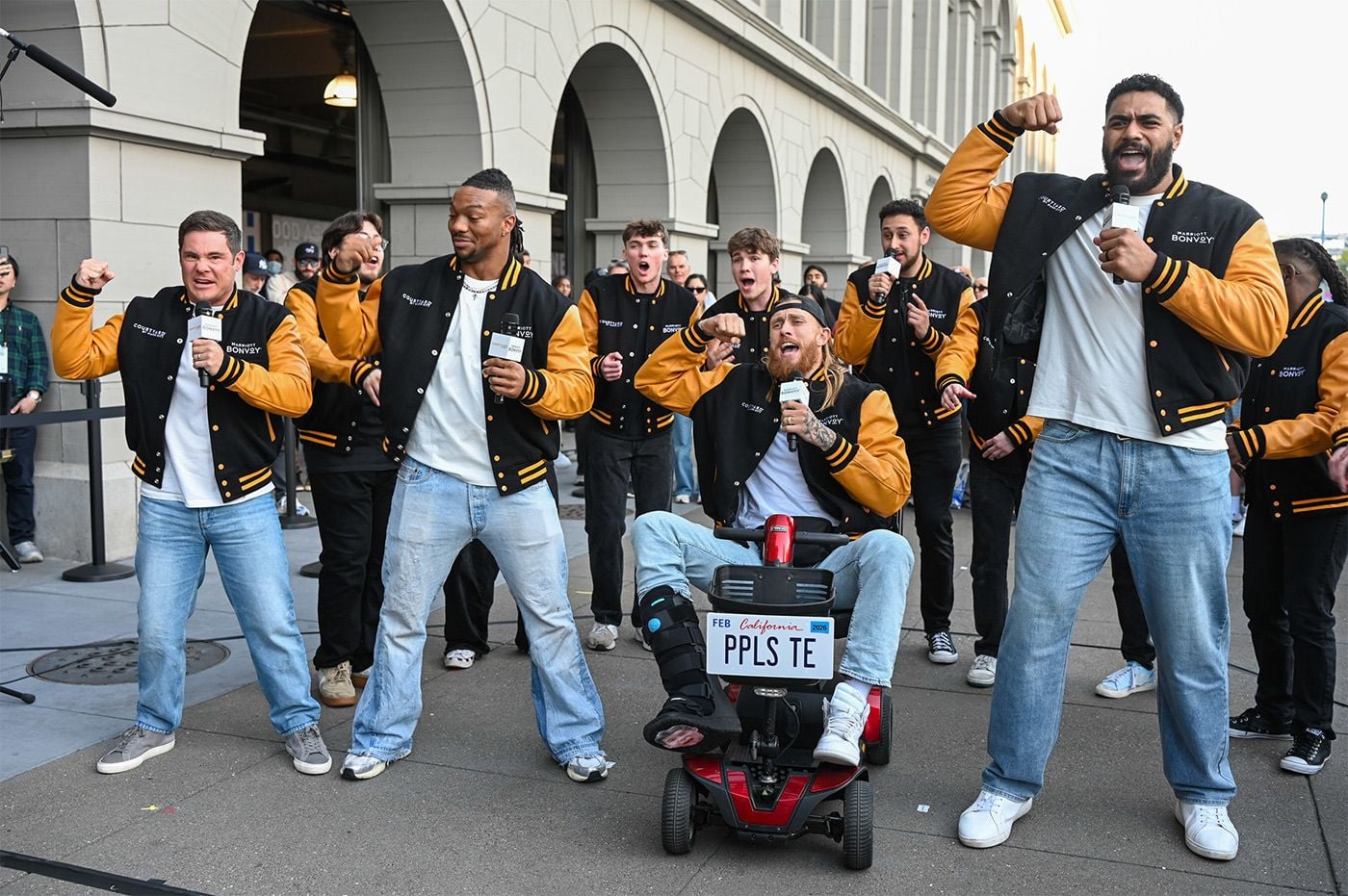 Adam Devine Leads 'Pitch Perfect'-Inspired Performance at Ferry Building With 49er George Kittle
