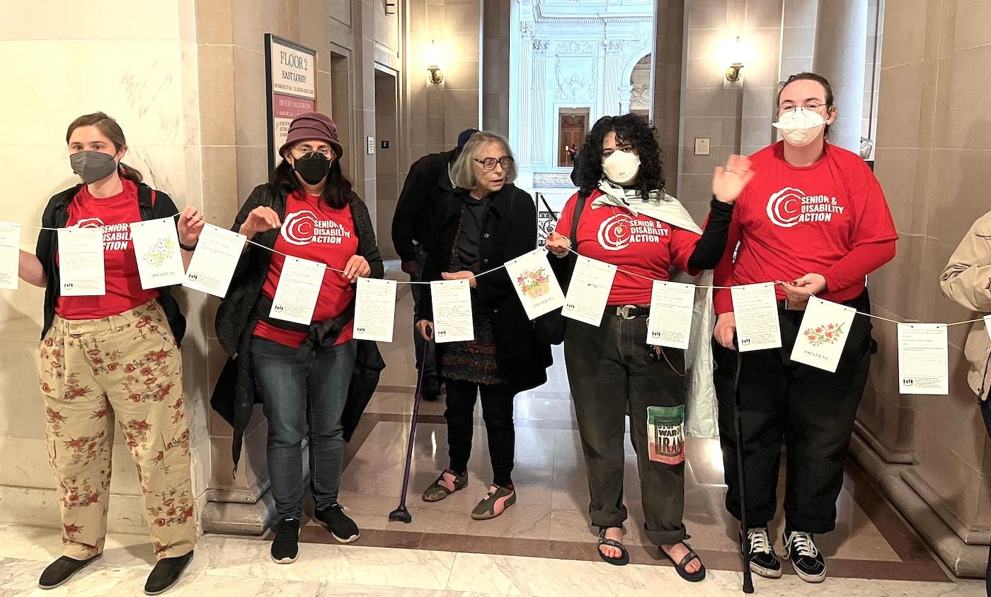 Hundreds Hand-Deliver Postcards to City Hall Urging Lurie to Stop Budget Cuts